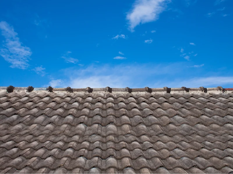 Concrete tiled roof mid-restoration